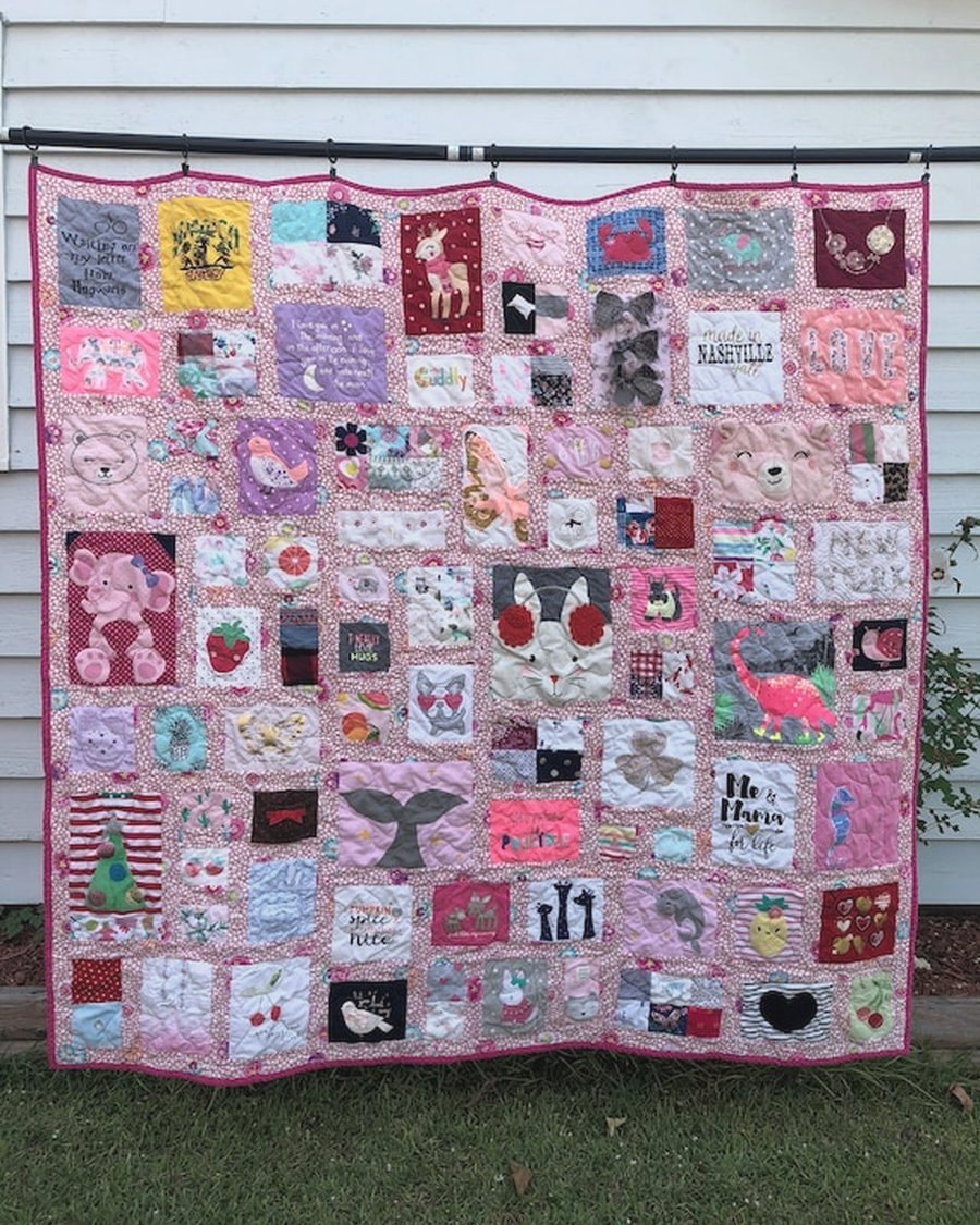 A handmade memory quilt made from a collection of preloved garments
