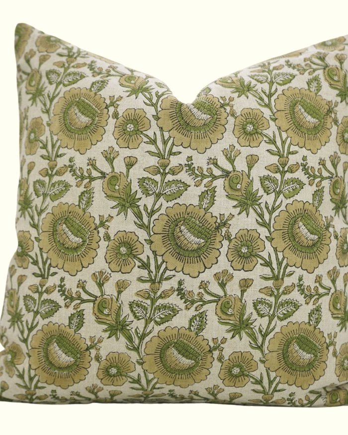 A textured throw pillow made from rescued upholstery fabric